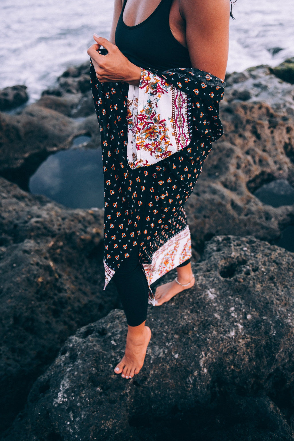 Floral beach wrap robe, independent photograph 4; styling props excluded. Photo: Brodie; Shopify Burst a-tanned-woman-with-patterned-shawl-poses-on-beach; Burst Some Rights Reserved. Editorial demo, not manufacturer endorsement.