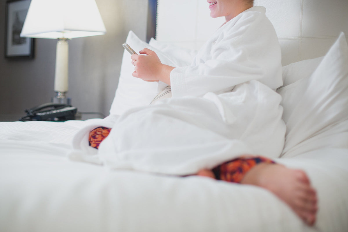 White hotel wrap robe, independent photograph 2; styling props excluded. Photo: Shopify Partners; Shopify Burst woman-relaxes-at-hotel; Burst Some Rights Reserved. Editorial demo, not manufacturer endorsement.