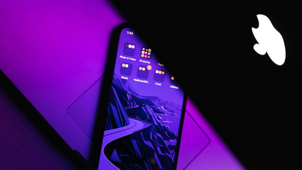 Purple Lit Phone — photograph 2. Photo: AltumCode; https://unsplash.com/photos/a-purple-cell-phone-TD_hYLm407A. Photographic demo.
