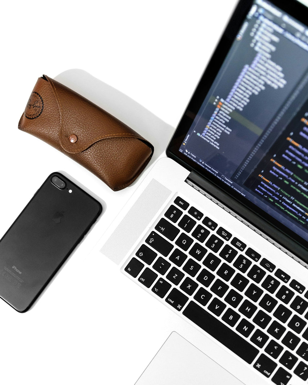 Silver Laptop — photograph 2. Photo: AltumCode; https://unsplash.com/photos/an-open-laptop-computer-sitting-next-to-a-cell-phone-AlPb3jxLbZw. Photographic demo.