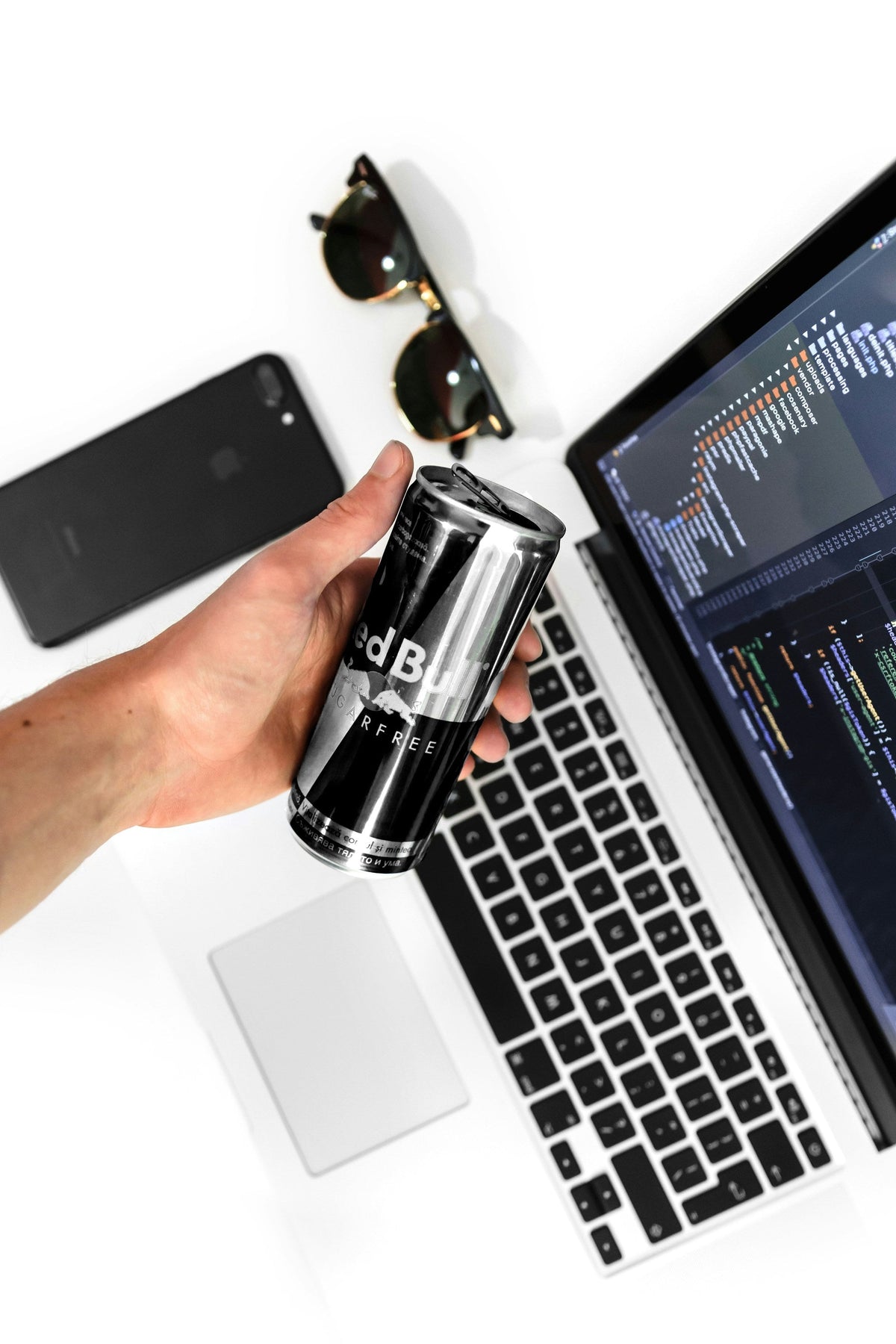 Silver Laptop — photograph 3. Photo: AltumCode; https://unsplash.com/photos/a-person-holding-a-can-of-beer-next-to-a-laptop-5Uh9DfKDb9I. Photographic demo.