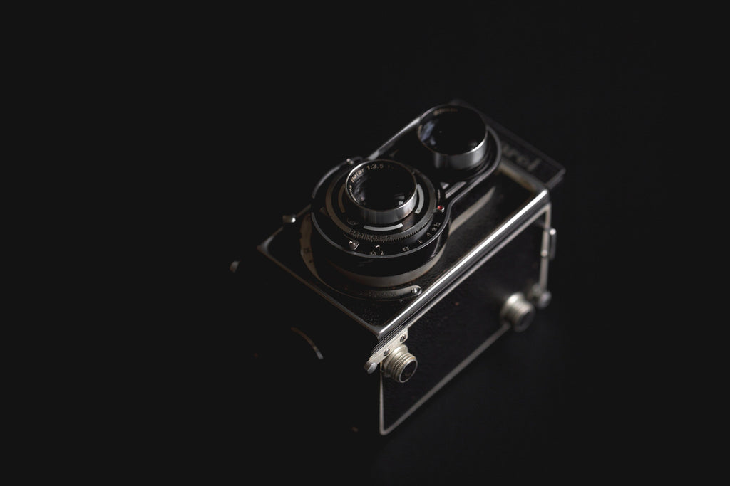 Twin Lens Film Camera — Photographic Demo — photograph 2. Photo: Matthew Henry; https://www.shopify.com/stock-photos/photos/vintage-camera-against-black. Photographic demo.