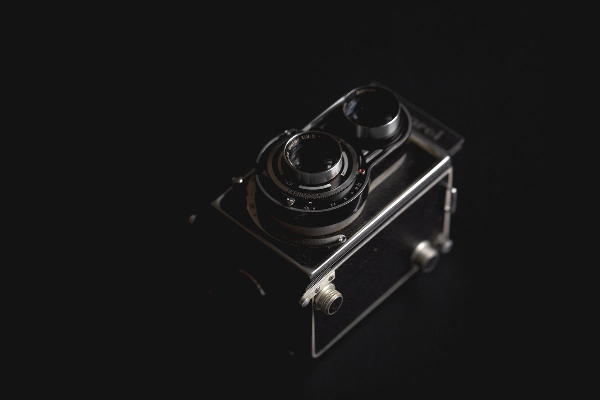 Twin Lens Film Camera — Photographic Demo — photograph 2. Photo: Matthew Henry; https://www.shopify.com/stock-photos/photos/vintage-camera-against-black. Photographic demo.