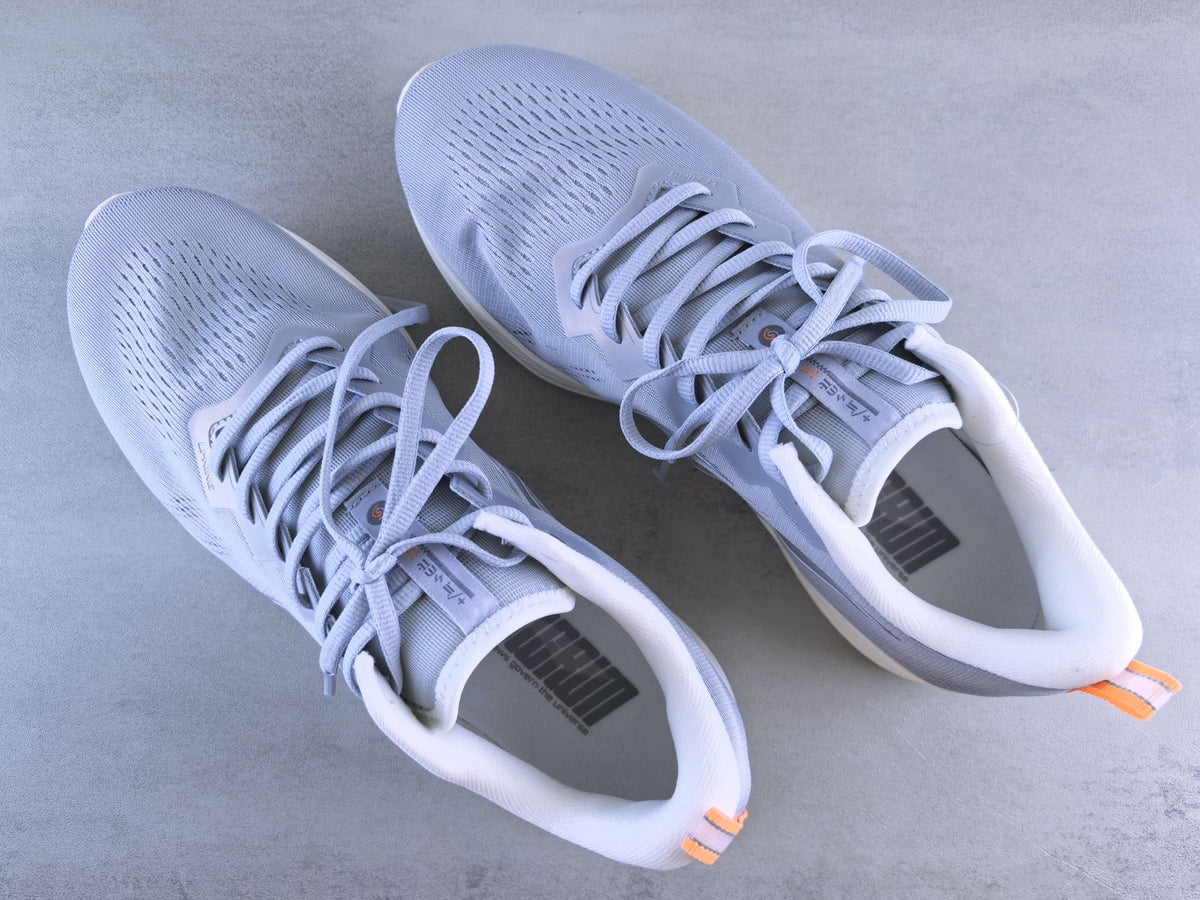 Road Glide in Fog — pair of light grey cushioned running shoes seen from above on a light grey surface