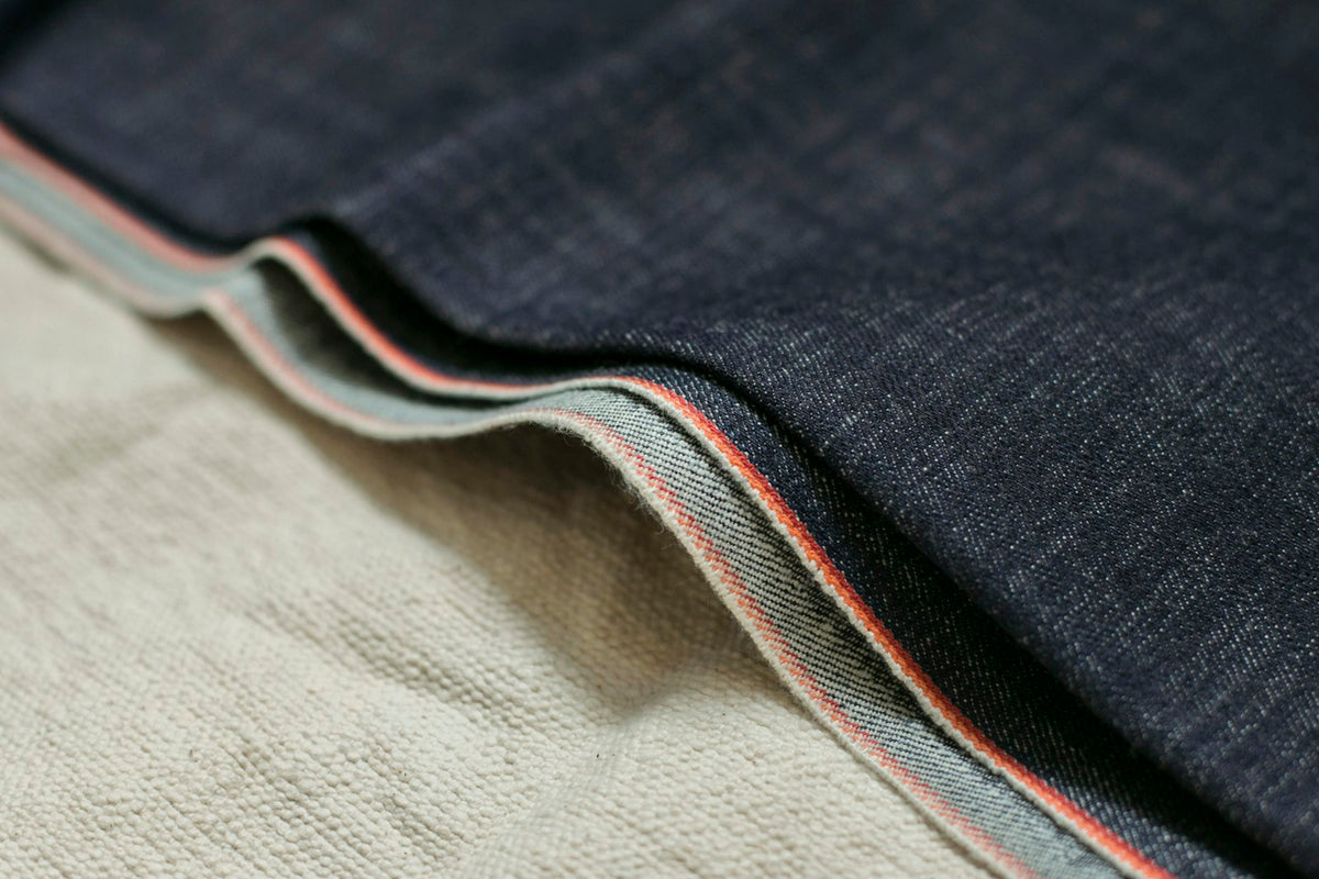Close-up of a selvedge denim hem with red-line edge
