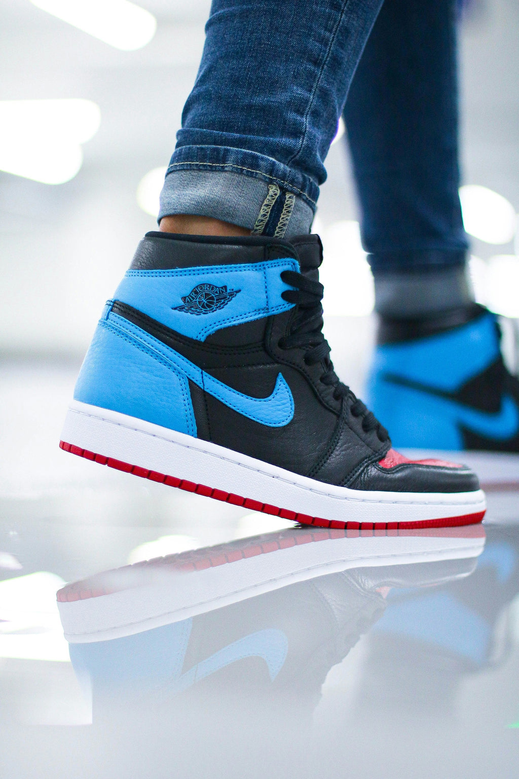 Blue Black High Top — Photographic Demo — photograph 2. Photo: Ryan Plomp; https://unsplash.com/photos/person-wearing-black-and-red-nike-air-jordan-1-shoes-tr_fXaYWgdw. Photographic demo.