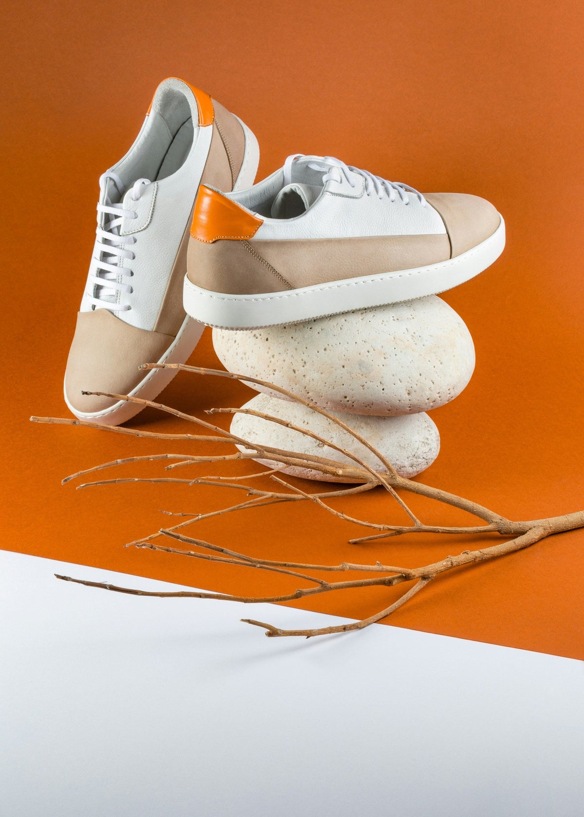 Sand Orange Low Top — Photographic Demo — photograph 2. Photo: Mojtaba Fahiminia; https://unsplash.com/photos/a-pair-of-shoes-sitting-on-top-of-a-pile-of-rocks-T9IqDhJVhEU. Photographic demo.