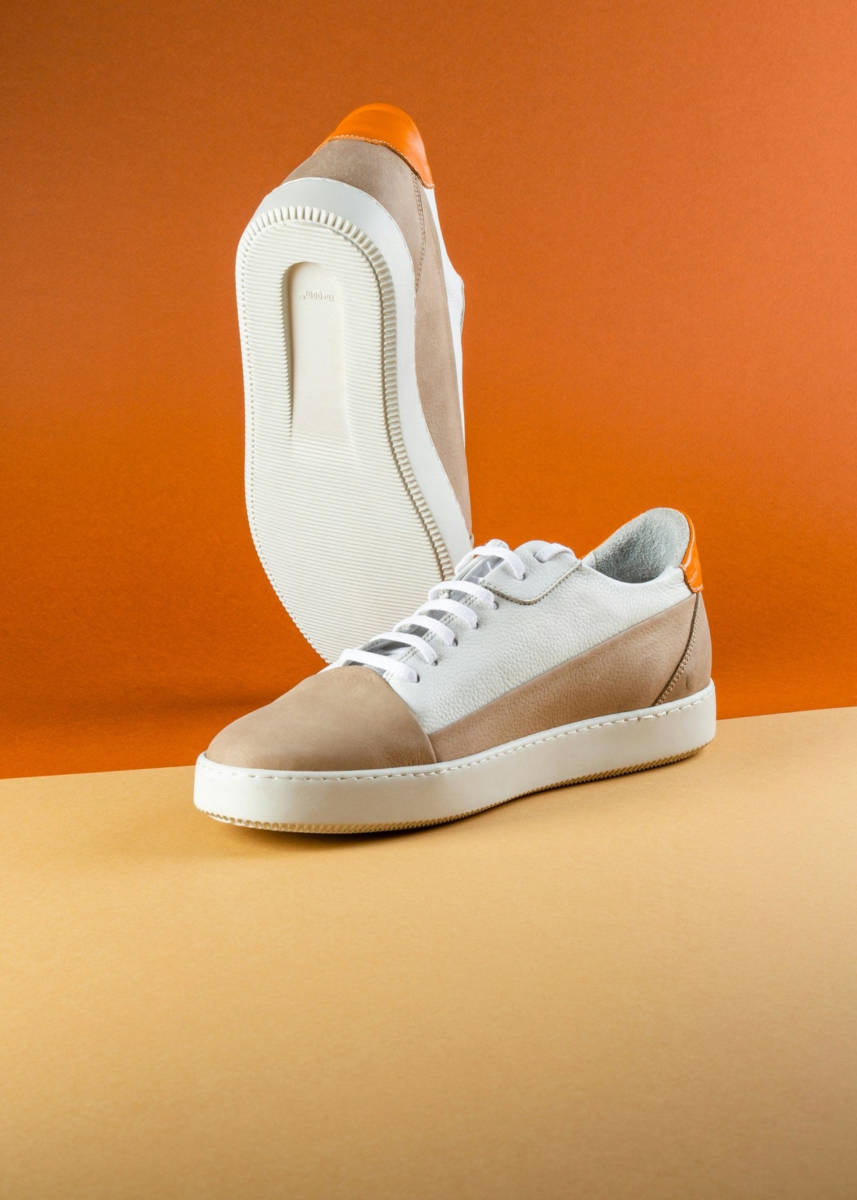 Sand Orange Low Top — Photographic Demo — photograph 3. Photo: Mojtaba Fahiminia; https://unsplash.com/photos/a-pair-of-white-and-brown-shoes-on-a-table-t4g1gctAaKk. Photographic demo.