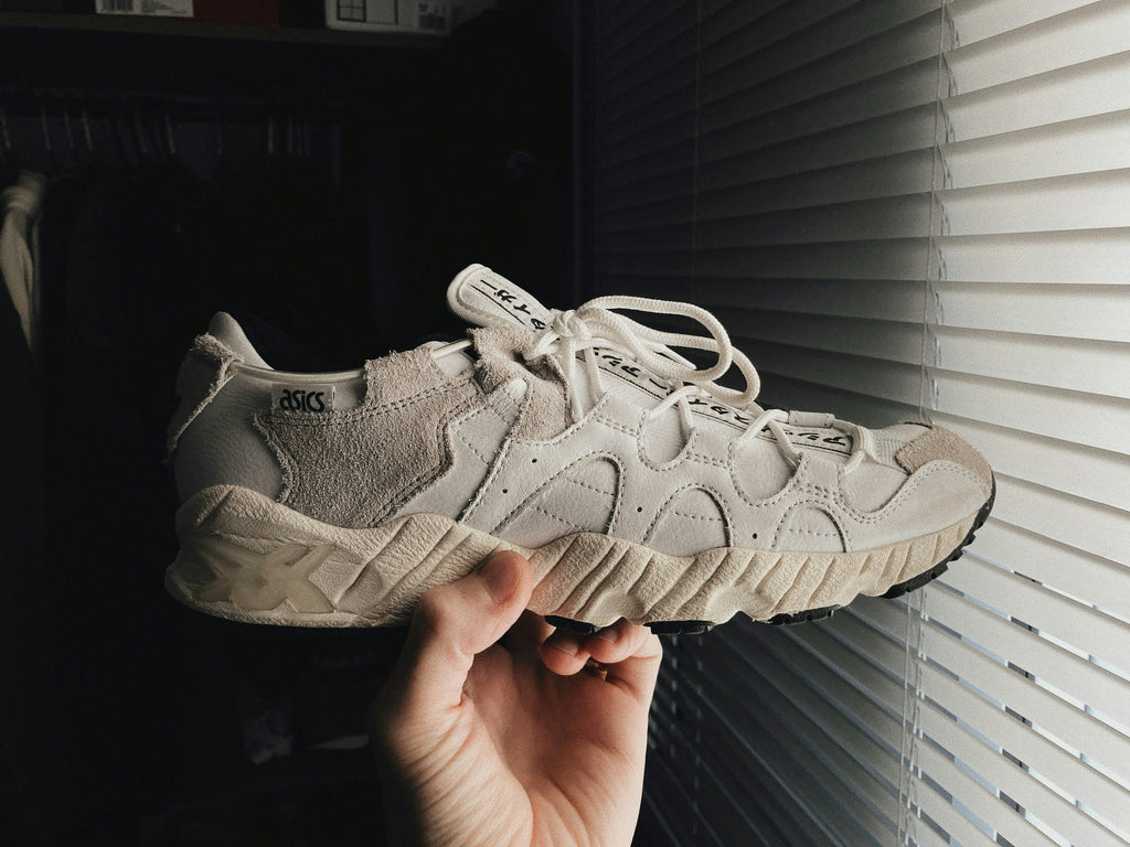 Sand Segmented Runner — Photographic Demo — photograph 1. Photo: @felirbe; https://unsplash.com/photos/a-person-holding-up-a-white-sneaker-in-front-of-a-window-Hl0gJVOqgUE. Photographic demo.