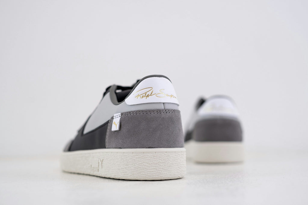Slate White Low Top — Photographic Demo — photograph 2. Photo: Hipkicks; https://unsplash.com/photos/black-and-white-nike-sneakers-lrLceSQ-tOI. Photographic demo.