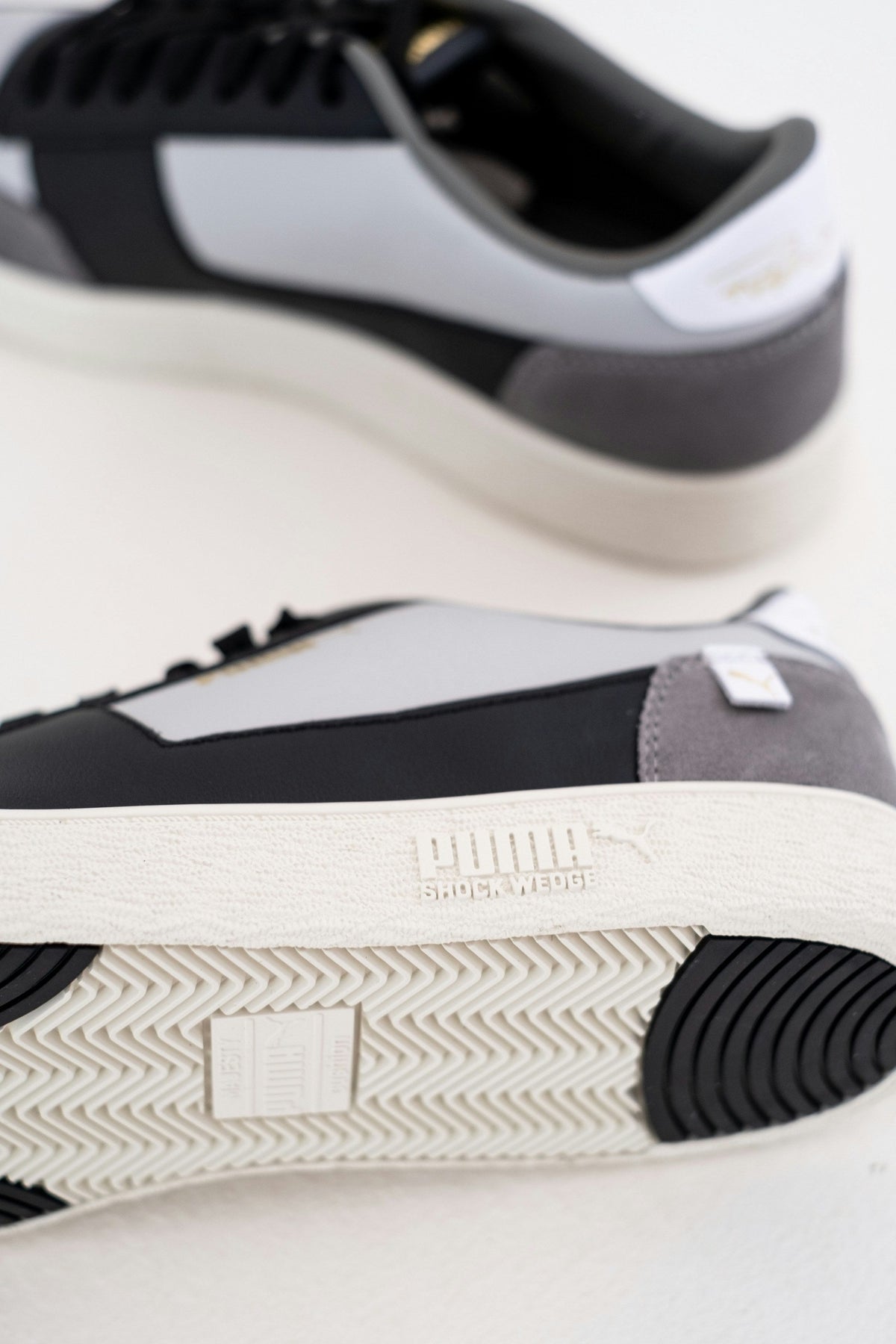 Slate White Low Top — Photographic Demo — photograph 3. Photo: Hipkicks; https://unsplash.com/photos/black-and-white-adidas-low-top-sneakers-WEzxOgwTND0. Photographic demo.