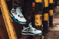 White Teal Sneaker — Photographic Demo — photograph 1. Photo: Matthew Henry; https://www.shopify.com/stock-photos/photos/sneakers-on-ladder. Photographic demo.